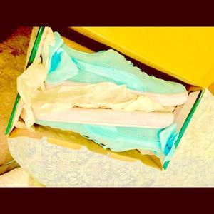 New Tiffany blue slip on pumas with bows